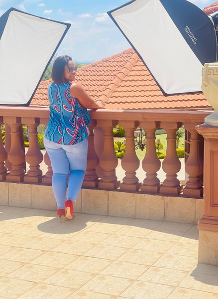 T15.2 High-Low Sleeveless Tank Top- Swirling abstract print in vibrant blue, red, and white tones