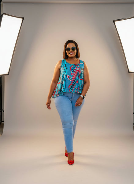 T15.2 High-Low Sleeveless Tank Top- Swirling abstract print in vibrant blue, red, and white tones